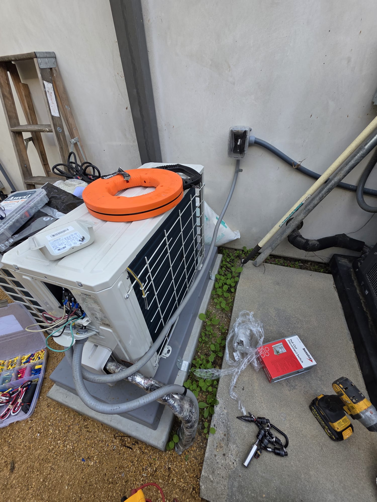 Outdoor condenser installation in progress
