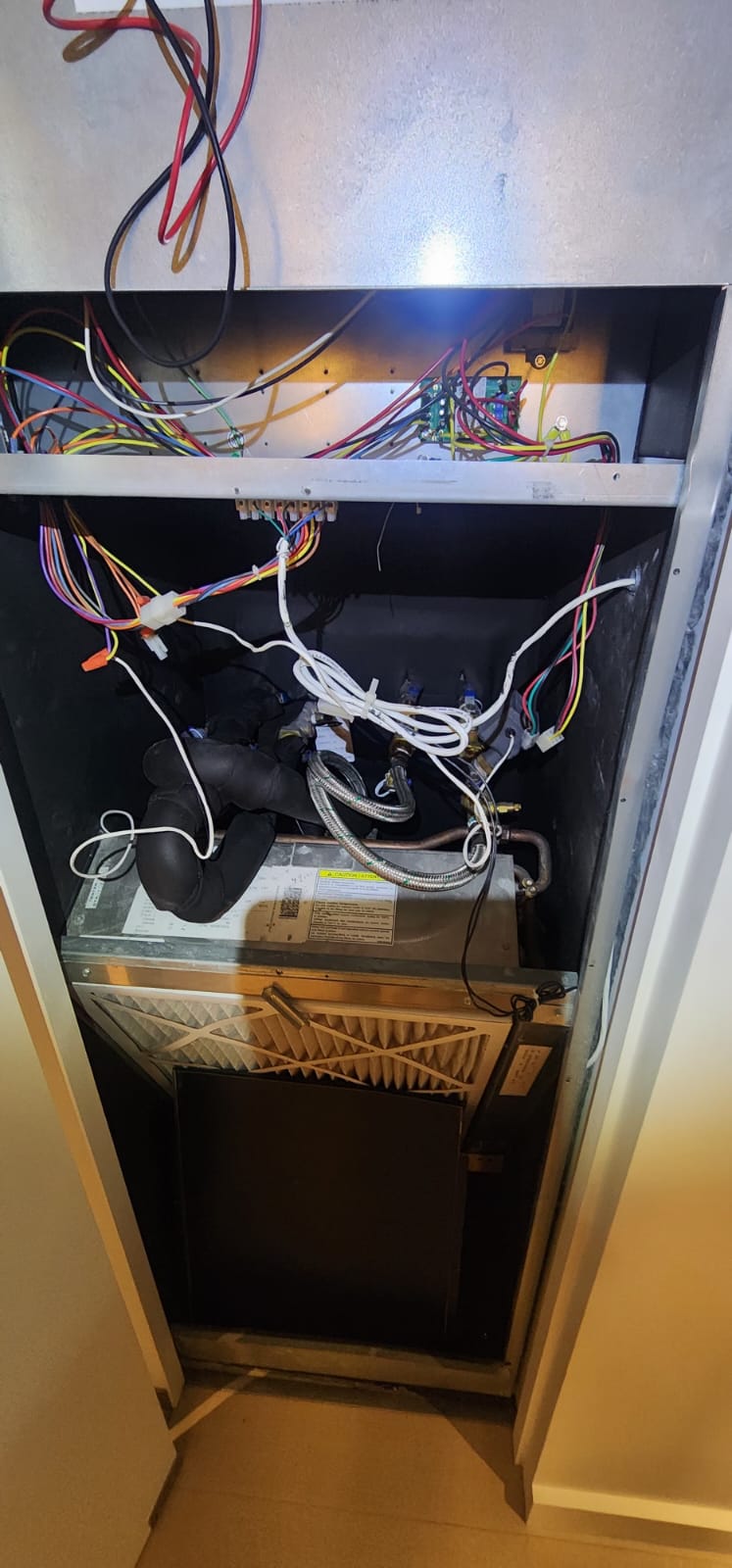 Indoor air handler opened for electrical and airflow diagnostics