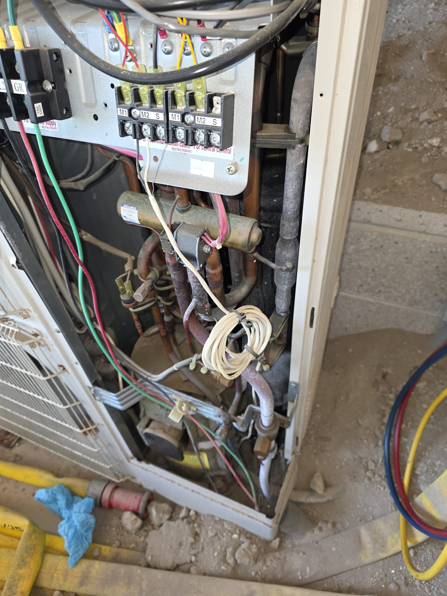 Outdoor HVAC control components inspected during technical service